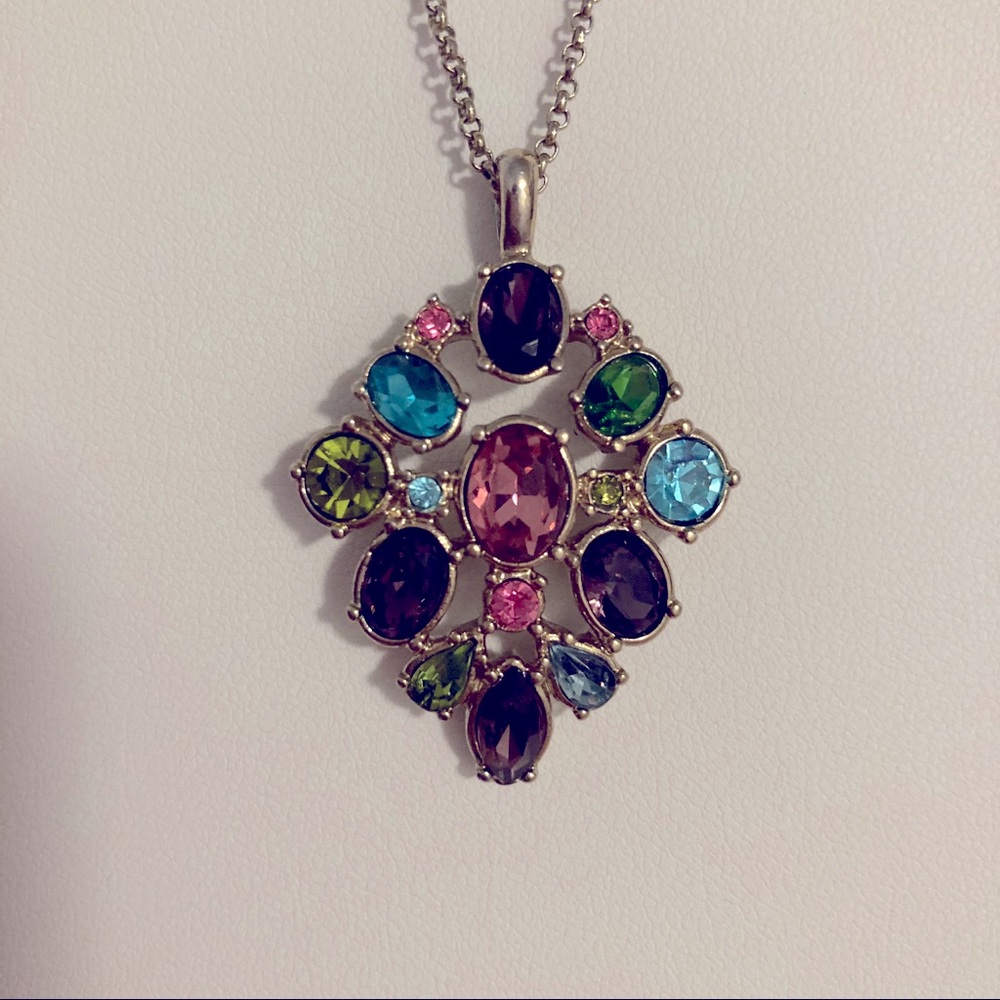 Necklace with glass stone of different colors.